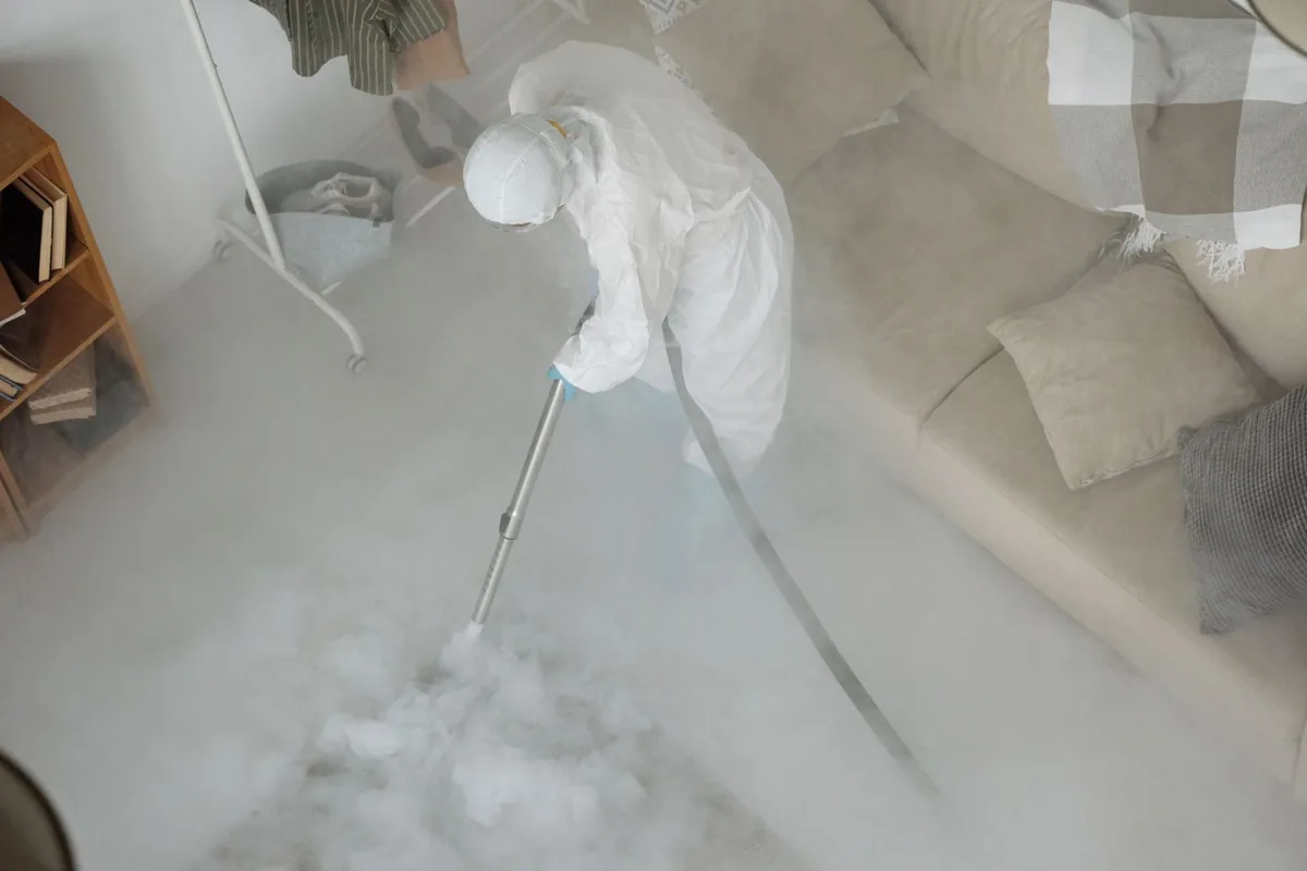 Biohazard cleanup technician in protective equipment, Asbury, IA